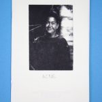 Black and white "Acne" zine cover. Photo of a young woman smiling. No text.