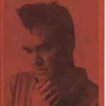 Black and white "A chance to shine" zine cover. Photograph of Morrissey from the Smiths on a brick red background. Prited text title on the top of the page.