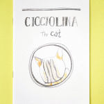 "Cicciolina the cat" zine cover. Colour illustration of a back of cat's head in a circle black border. Bold handwritten title.