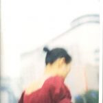 Colour "Elk" issue 17 cover. Out of focus photograph of a dark-haired girl in a dark red top.