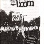 Black and white "Kerboom" cover. Photocopied photograph af a protestor holding 'No police state' banner and standing in front of the policemen.