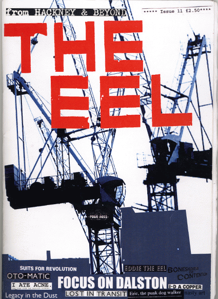 Colour, mostly black and dark blue "The Eel" issue 11 zine cover. Photograph of two tower cranes. Bold red printed title on the top.