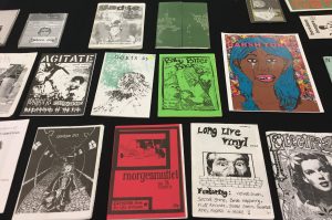 Colour photograph of a grid consisting of around ten zines.