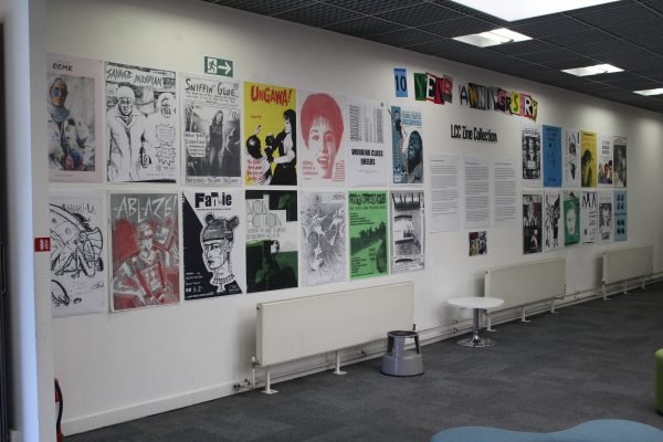 Image of a wall display of enlarged zine covers in the Library at London College of Communication.
